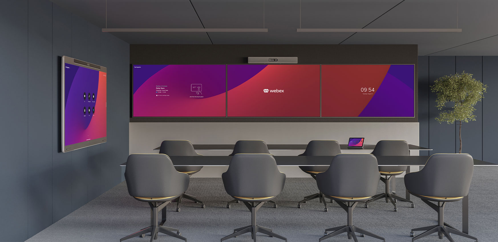 A large training room with the Cisco Room Kit Pro above three displays and a Cisco Board Pro against the side wall.