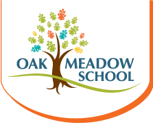 Oak Meadows logo. The text reads Oak Meadows school with a colorful tree between the works Oak and Meadows